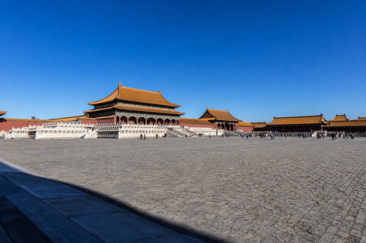 A clear autumn day over the Forbidden City's golden rooftops with light crowds