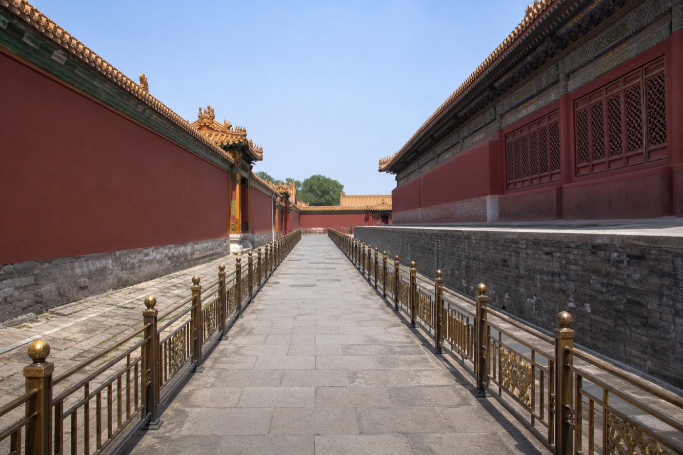 A clear stone pathway through a Forbidden City courtyard with red walls on either side