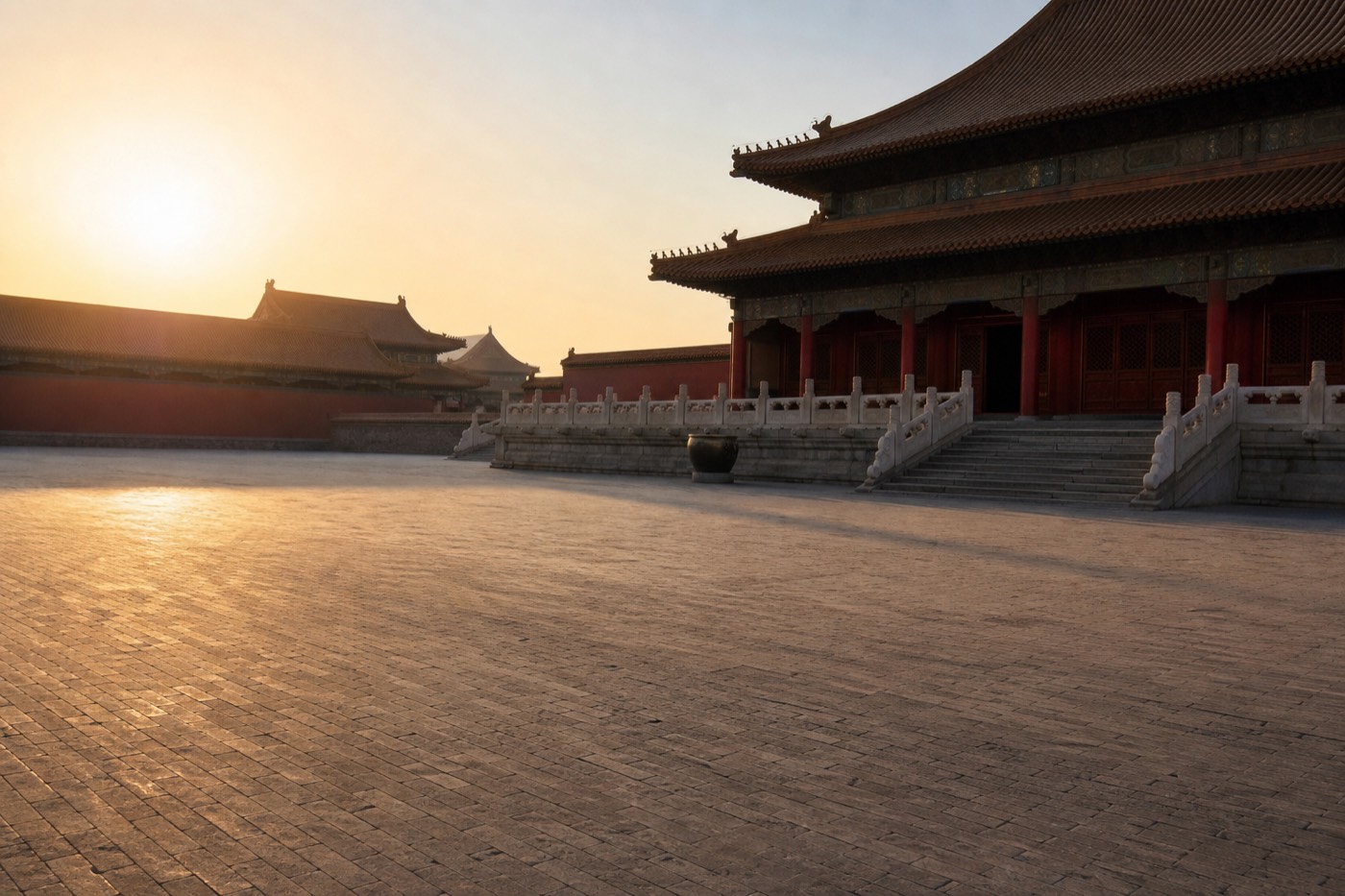 An empty Forbidden City courtyard in soft early morning light before the crowds arrive
